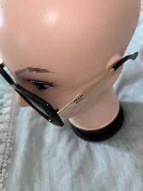 Prada Black Frame Sunglasses with Gold Temples